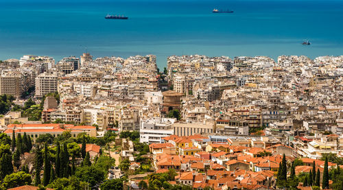 High angle view of townscape against blue sky