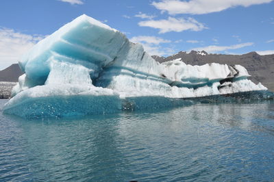 Scenic view of frozen sea against sky