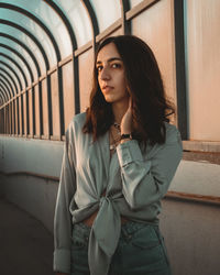 Portrait of beautiful young woman looking away