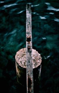 High angle view of wooden post in sea