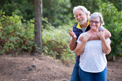 Man and woman standing outdoors