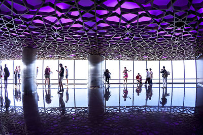 Group of people in front of built structure