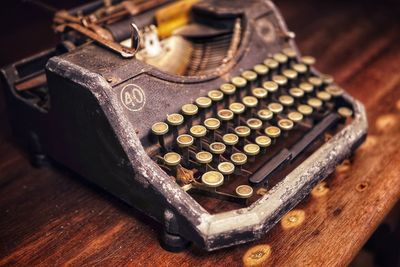 Close-up of old machinery on table