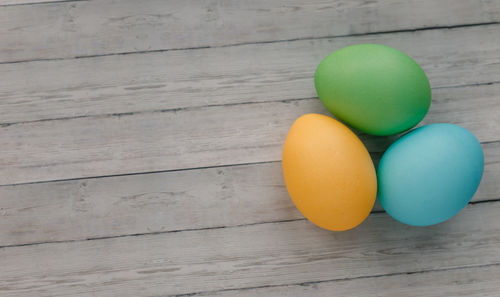 High angle view of multi colored eggs on table