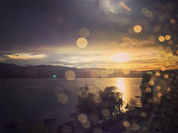 Close-up of sea against sky at sunset