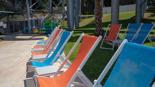 View of chairs in swimming pool