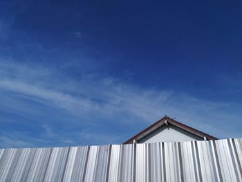 Low angle view of wooden house against sky