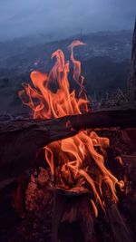 Close-up of fire burning on wood