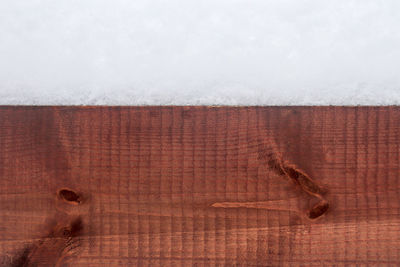 Close-up of snow on wood
