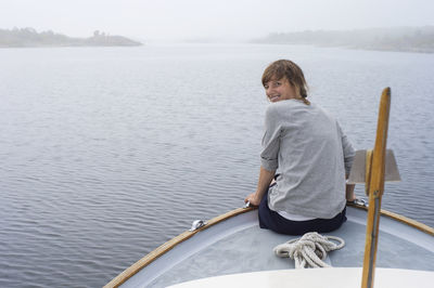 Smiling woman on boat, sweden
