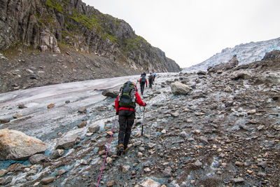 Rear view of man standing on mountain