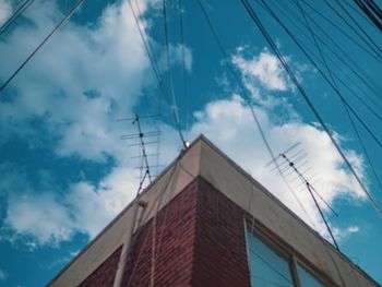 Low angle view of cables against sky