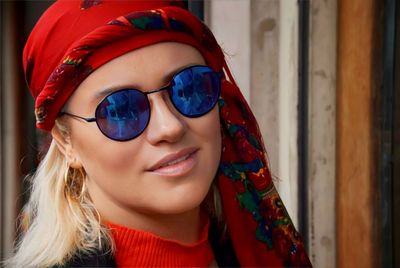 Portrait of young woman wearing sunglasses