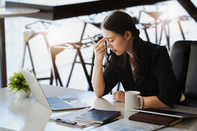 Businesswoman working on table