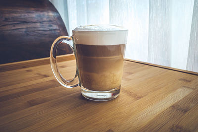 Close-up of coffee cup on table