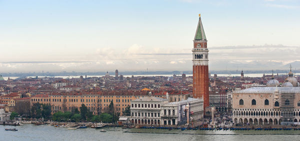 Grand canal and san marco campanile in city against sky