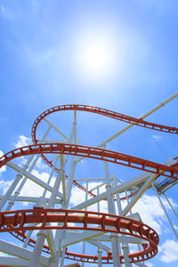 Low angle view of ferris wheel against sky