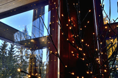 Low angle view of illuminated bridge against sky at night