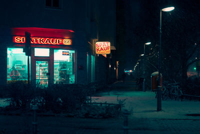 Illuminated sign in city at night