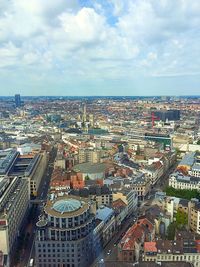 Cityscape against cloudy sky