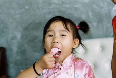 Portrait of cute girl eating