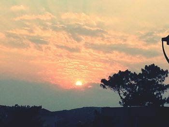 Scenic view of cloudy sky at sunset
