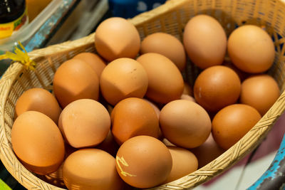 High angle view of eggs in basket for sale