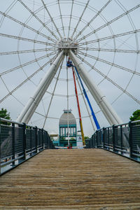 Ferris wheel in city against clear sky