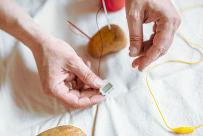 High angle view of man holding hands