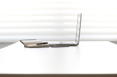 Close-up of laptop on table