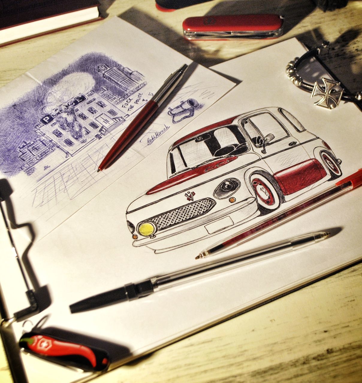 close-up, no people, indoors, still life, pen, table, paper, mode of transportation, high angle view, transportation, car, retro styled, motor vehicle, text, communication, book, travel, creativity, art and craft, luxury