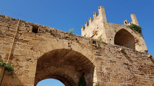 Low angle view of fort against blue sky