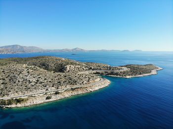 Scenic view of sea against clear blue sky