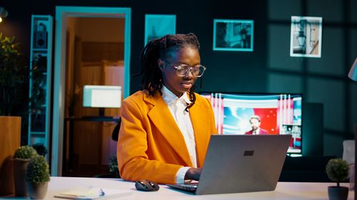 Young woman using laptop on table