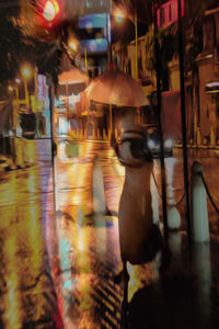 Blurred motion of wet street at night