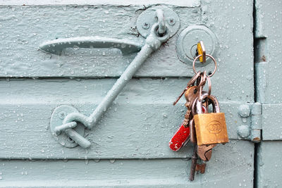 Close-up of lock hanging from door