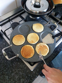 Cropped hand of person preparing food