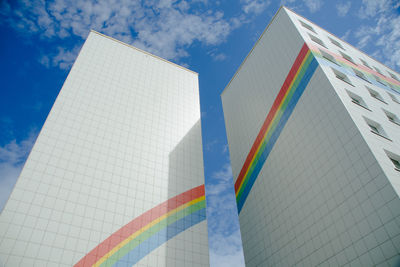 Low angle view of modern building against blue sky