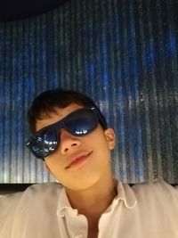 Portrait of young woman wearing sunglasses