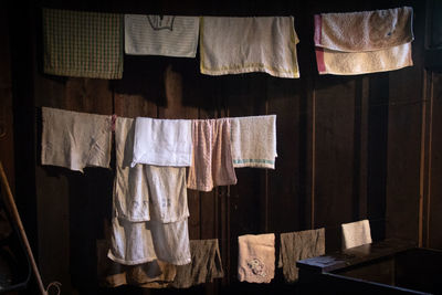 Clothes drying on clothesline against wall