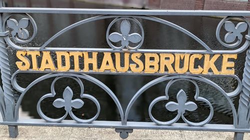 Close-up of text on metal gate