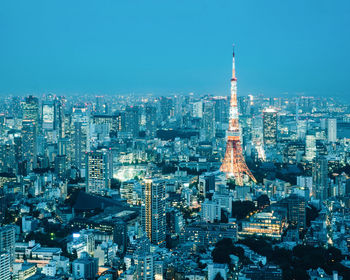 Aerial view of city lit up at night