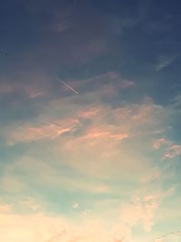 Low angle view of vapor trails in sky