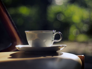 Close-up of coffee cup on table