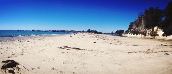 Scenic view of beach against clear sky