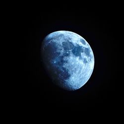 Low angle view of moon against clear sky at night