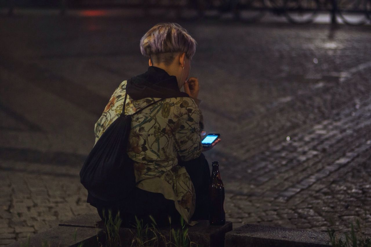 lifestyles, casual clothing, full length, leisure activity, standing, three quarter length, rear view, person, young adult, focus on foreground, side view, jacket, front view, holding, outdoors, childhood, warm clothing, young men