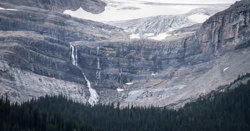 Big glacier fall detail shot with glacier and surrounding environment, canadian rockies, canada