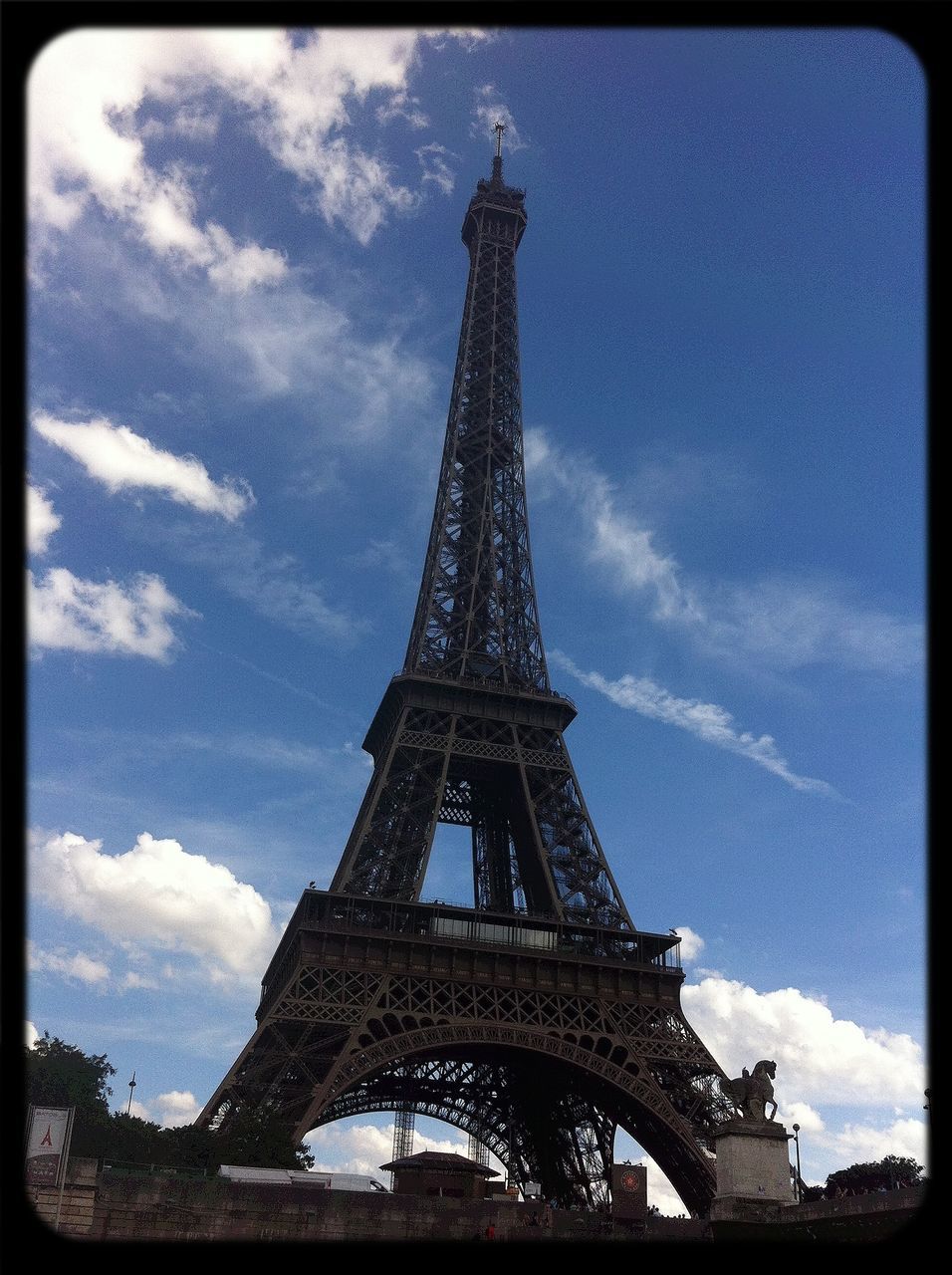 eiffel tower, architecture, built structure, international landmark, famous place, culture, tower, sky, travel destinations, history, metal, tourism, low angle view, capital cities, travel, tall - high, transfer print, cloud - sky, architectural feature, auto post production filter