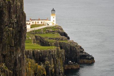 Panoramic view of sea and buildings against sky
